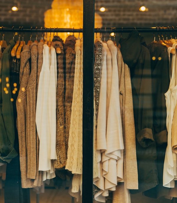 Rack of folded and hanging clothes